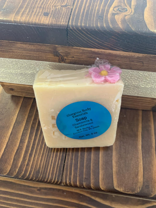 Chamomile & Sandalwood: “A serene blend of soothing chamomile and warm sandalwood, crafted to calm the mind and comfort the skin.